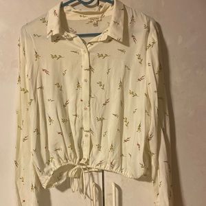Long sleeve off white blouse with a flower pattern